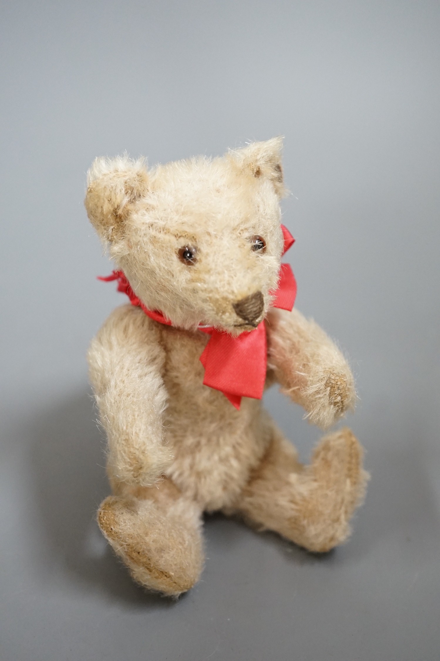 A small Steiff bear, with button in ear, c.1920, 14cm high